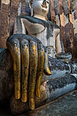 Thailand - Old Sukhothai - Wat Si Chum the right hand with long fingers of the impressive 15 meter high seated Buddha statue is a representative example of Sukhothai sculpture. 